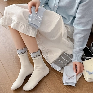 Japanese style women's crew socks with cute bow accents and ruffled trim details