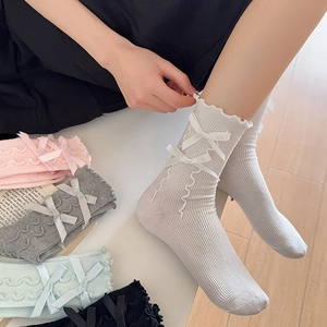 Ballet style ribbed mid-calf socks with cute side ribbons and ruffled lace cuffs