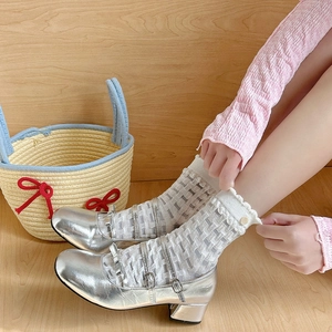 Close-up of white mesh mid-calf socks with frill lace and silver bow Mary Jane shoes
