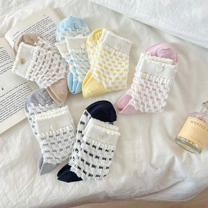 Set of six Japanese-style pastel socks featuring 3D diamond mesh and pearl button details