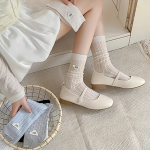 Japanese style cream ribbed crew socks with stylish triangle letter design label