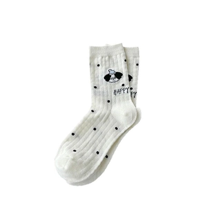 White Japanese crew socks with cartoon puppy and black polka dots for women