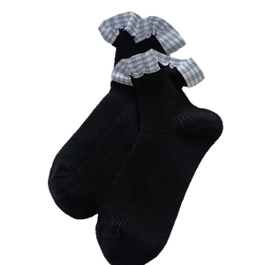 Japanese style black crew socks with blue gingham ruffled cuffs for women
