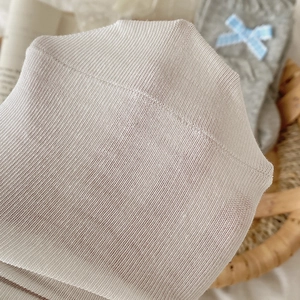Detailed macro view of white ultra-thin ribbed mesh socks with high stretch fabric