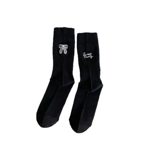 Black ballet-style socks with white bow embroidery and Sweet Candy text detail