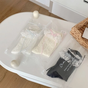Three-pack Lolita lace trim socks in white, beige, and black with bow detail in zip bags