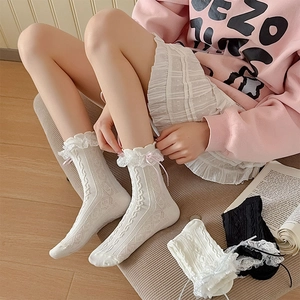 Lolita style knee high socks with delicate lace ruffles and cute ribbon bow accents