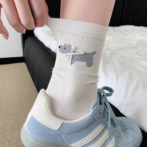 Calze a metà polpaccio color crema con jacquard terrier e fiocco in nastro bianco