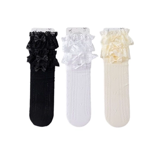 Three pairs of lace trim knee high socks with hollow knit and bow details