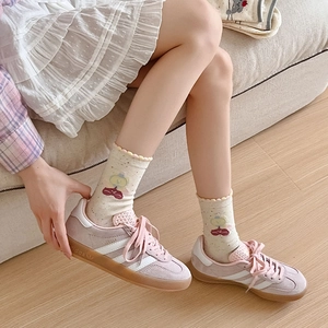 Pink suede sneakers with classic stripes and cute cartoon bear pattern crew socks