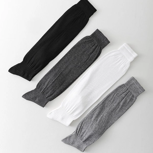 Detailed close-up of knit calf socks in four neutral colors with ribbed cuffs