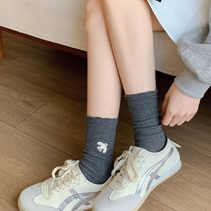 Cute dark gray ribbed crew socks featuring a delicate white bird embroidery for women