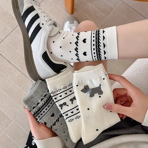 Cute women's crew socks with puppy embroidery, heart patterns, and knit bow details