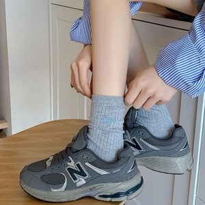 Japanese style grey crew socks featuring cute blue bowknot embroidery and cherry accents