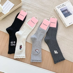 Detail of four-pair cotton crew socks set with cute cartoon embroidery and ruffle cuffs