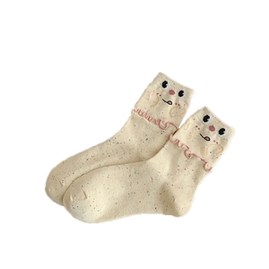 Cute beige mid-calf socks with confetti yarn and cartoon bear face ruffle trim