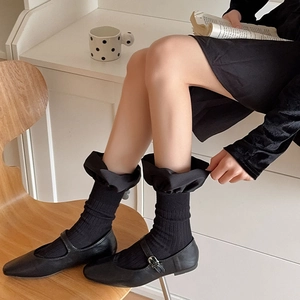 French style satin ruffle socks paired with black Mary Jane shoes for a sweet retro look