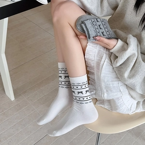 Japanese style crew socks for women featuring cute bow and heart jacquard patterns