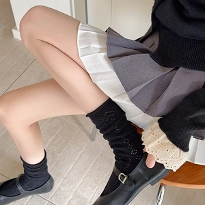 Detail of black mesh hollow-out crew socks with breathable pattern for women