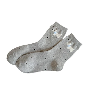 Grey mid-calf socks with black polka dots and cute Westie dog embroidery detail