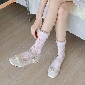 Women's white Mary Jane flats with beaded detail paired with pink ribbed crew socks