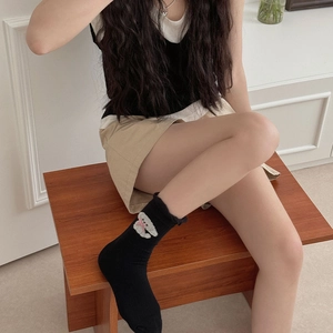 Cute black crew socks for women featuring white bear embroidery and pink bow detailing