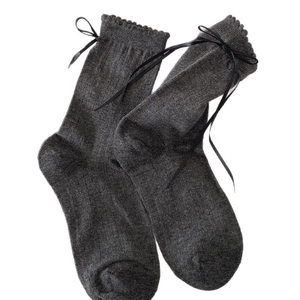 Dark gray knit crew socks with black satin ribbons and elegant scalloped lace edges