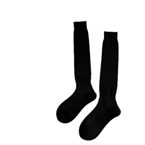 Classic black knee-high knitted stockings with elastic ribbed cuffs for daily uniform wear