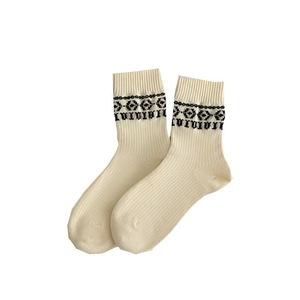 Minimalist beige mid-calf socks featuring vintage geometric patterns and ribbed knit texture