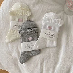 Three pairs of sweet ruffled socks with heart embroidery in white, grey, and beige