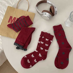 Detailed set of four dark red cotton crew socks with patterns and lace ruffles