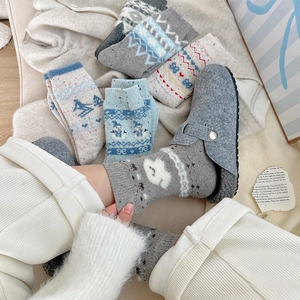 Winter Fair Isle wool socks featuring festive snowman patterns and Nordic knit details