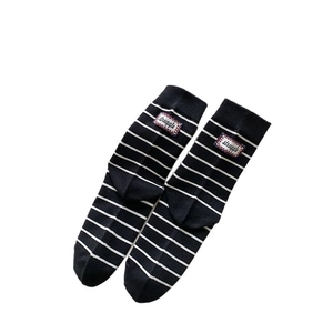 Striped knit mid-calf socks with rib cuffs and struggle patch in black and white