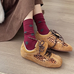 Vintage brown suede sneakers with leopard print details and red polka dot crew socks