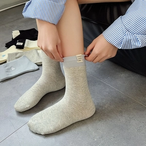 Women's heart embroidered mid-calf socks with vintage fabric labels in various colors