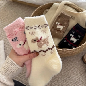 Close-up of thick plush socks with cute cartoon puppy patterns and bow details in four colors