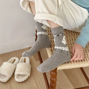 Fair Isle grey wool socks with cute white rabbit patterns for cozy winter warmth