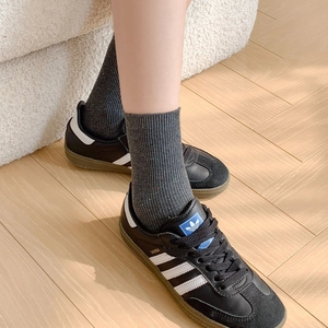 Japanese style grey ribbed mid-calf socks with colorful flecks shown on model