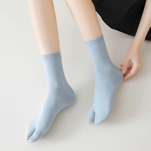 Detail of light blue split-toe tabi socks with breathable ribbed cuffs for flip-flops