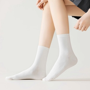 Detail of white cotton tabi socks with ribbed cuffs and reinforced toe stitching
