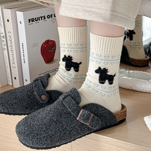 Grey felt clogs with cork sole paired with blue heart and pony patterned socks
