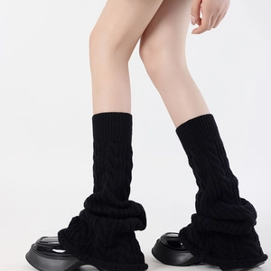 Japanese style black cable-knit leg warmers with flared fit and thick wool texture