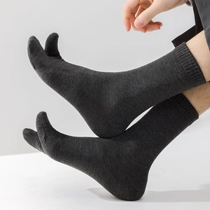 Close-up of dark grey tabi socks with fine knitted texture and unique split-toe design