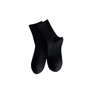 Black confetti yarn crew socks with colorful speckles and ribbed texture on white background
