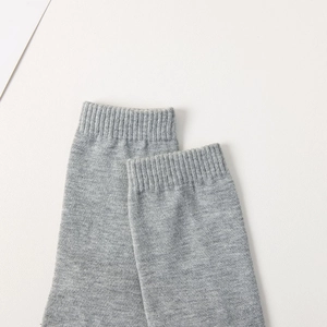 Close-up of gray tabi sock showing the detailed ribbed knit texture and elastic cuff