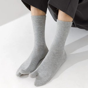 Close-up of dark grey Tabi split-toe cotton socks for men with fine knit texture detail