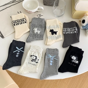 Detailed set of 8 knitted mid-calf socks with puppies, ribbons, and bow decorations