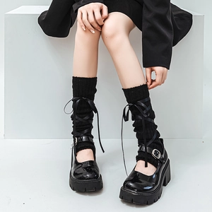 Ballet style knit leg warmers with ribbon bows and platform black Mary Jane shoes
