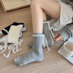 Detail of Korean style lace trim socks with ribbed texture in grey, white and black colors