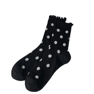 Sweet ballet style black crew socks with white polka dots and delicate ruffle trim